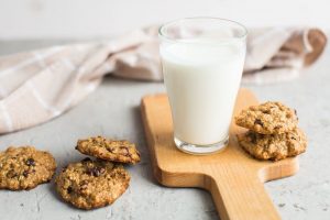 66109944 - breakfast: a glass of milk and homemade oatmeal cookies