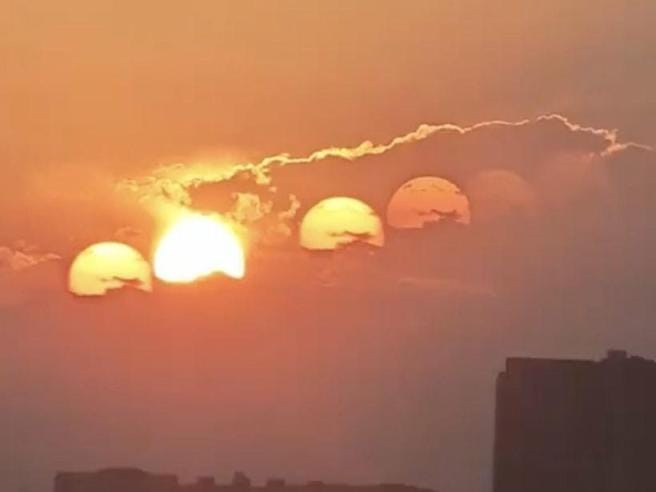 tramonto con sette soli in cina